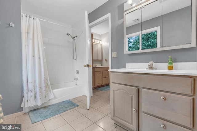 bathroom with tile patterned flooring, shower / bathtub combination with curtain, and vanity