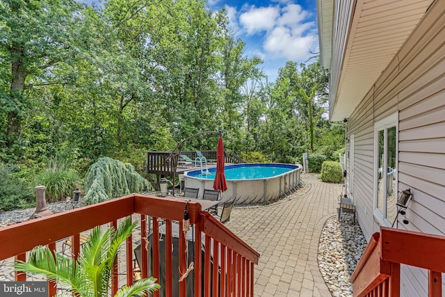 wooden terrace with a patio