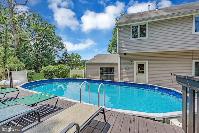 view of swimming pool featuring a wooden deck