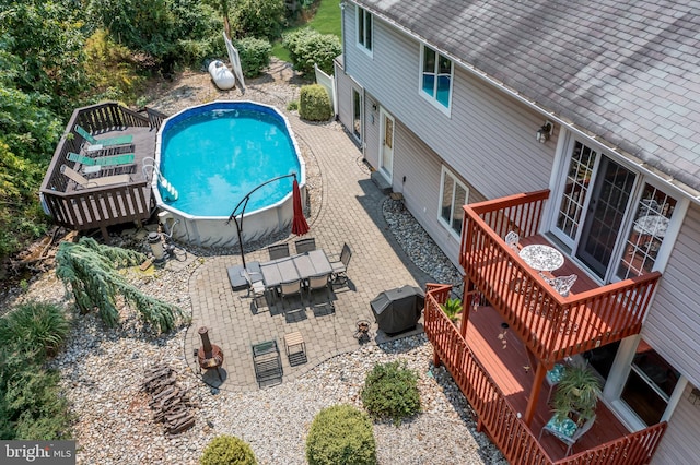 view of swimming pool featuring a patio area