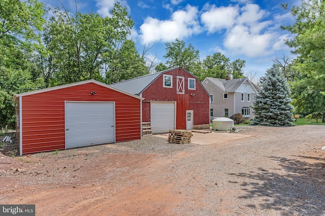 view of front of home with an outbuilding and a garage