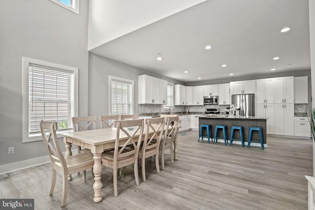 dining room with light hardwood / wood-style flooring