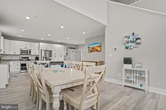 dining space featuring light hardwood / wood-style floors