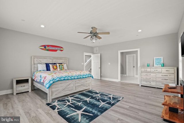 bedroom featuring light hardwood / wood-style flooring and ceiling fan