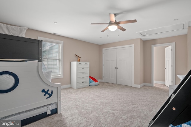 carpeted bedroom with a closet and ceiling fan