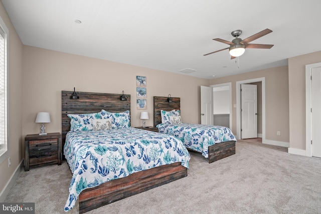 bedroom featuring light carpet and ceiling fan