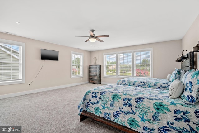 bedroom with ceiling fan and carpet flooring