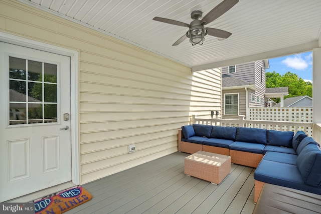 wooden terrace featuring ceiling fan and outdoor lounge area