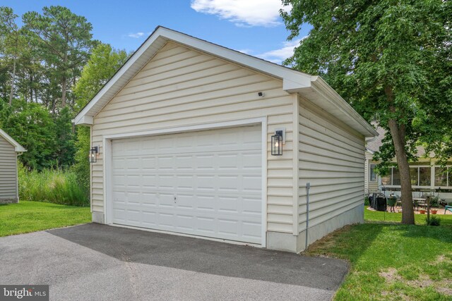 garage with a lawn