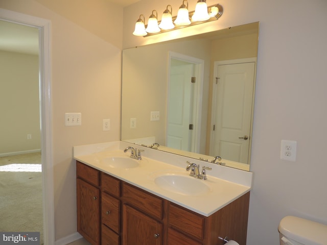 bathroom with vanity and toilet