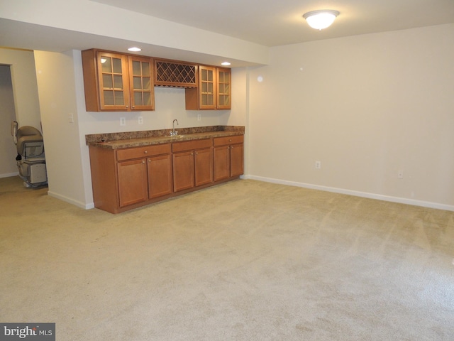 kitchen with sink and light carpet