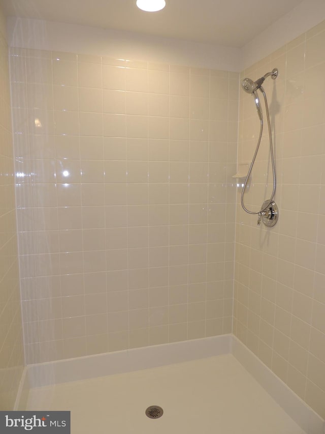 bathroom with tiled shower