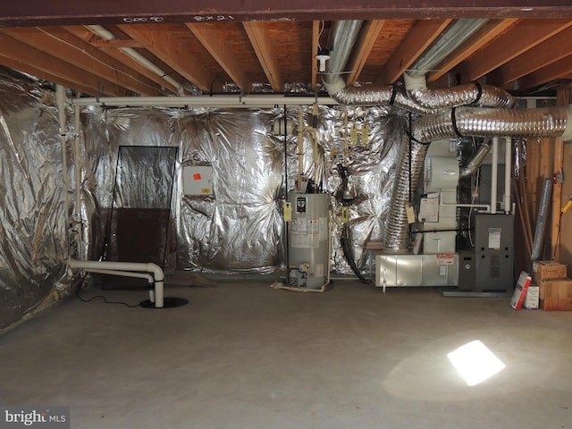 basement featuring gas water heater and heating unit