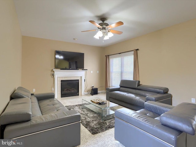 carpeted living room featuring ceiling fan