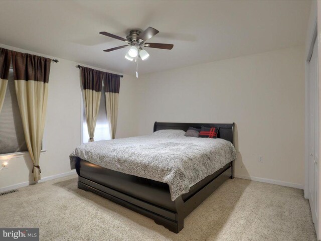 carpeted bedroom featuring ceiling fan