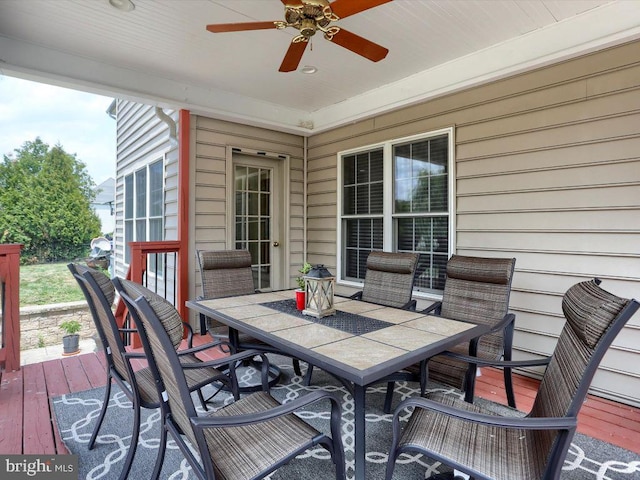 wooden deck featuring ceiling fan