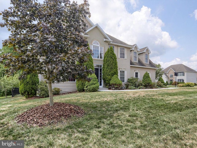 view of front of home with a front lawn