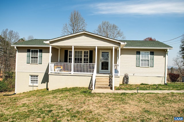 single story home featuring covered porch and a front lawn