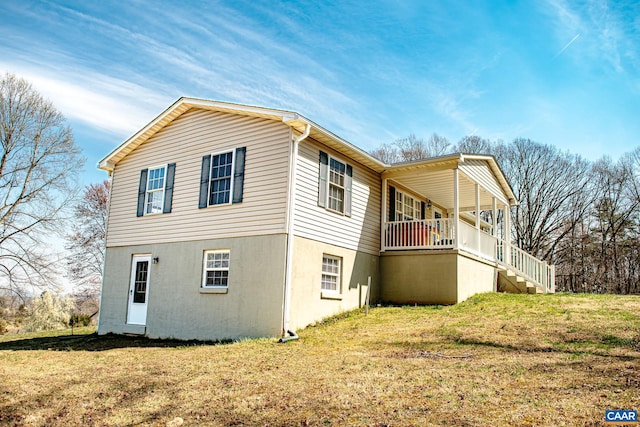 view of side of property with a yard