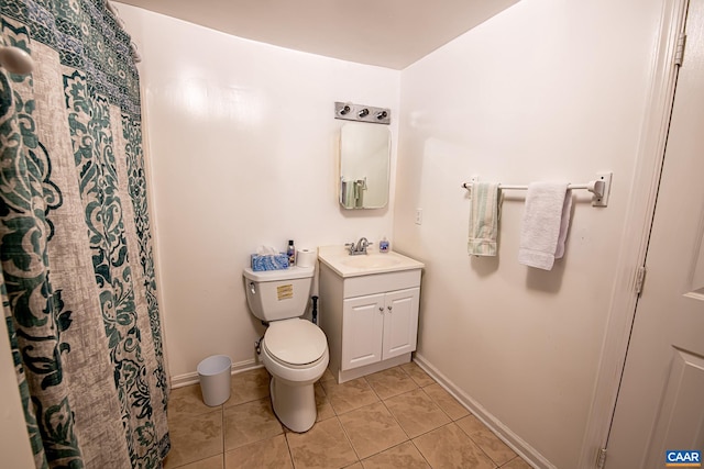 bathroom with tile patterned flooring, vanity, a shower with curtain, and toilet