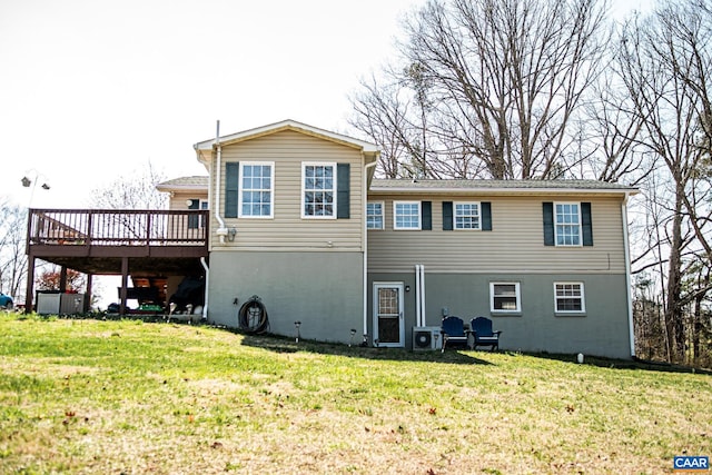 back of property with a wooden deck, a lawn, and central air condition unit