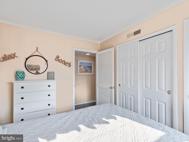 unfurnished bedroom with ornamental molding and a closet