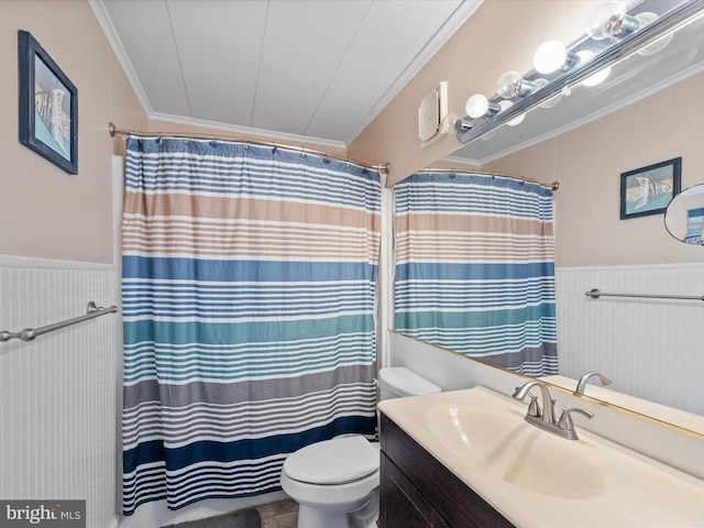 bathroom featuring vanity, ornamental molding, and toilet