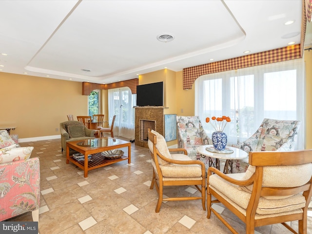 living room featuring a raised ceiling