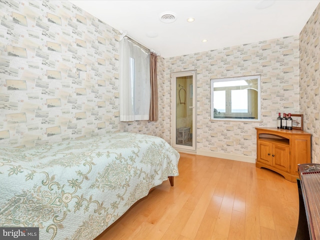 bedroom with wood-type flooring