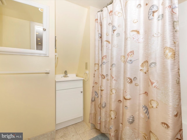 bathroom with walk in shower, tile patterned floors, and sink