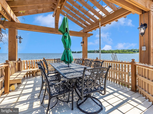 deck featuring a pergola and a water view