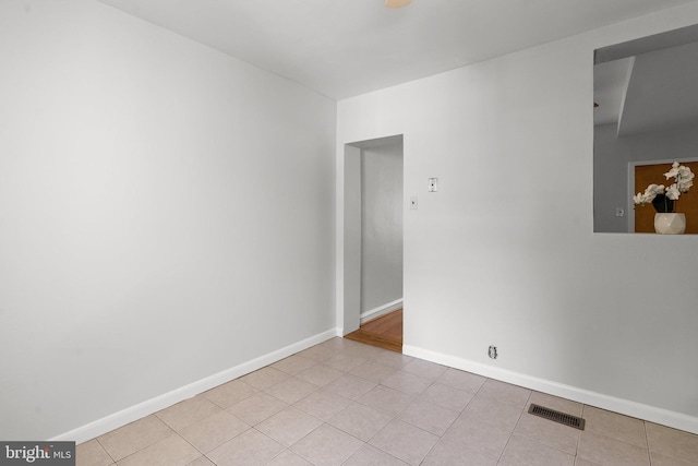 empty room featuring light tile patterned floors