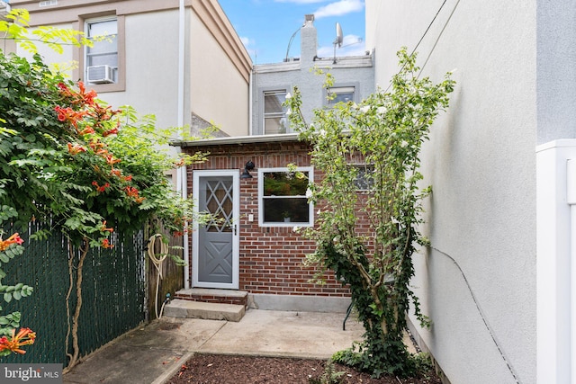 doorway to property with cooling unit