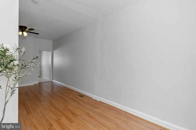 unfurnished room with ceiling fan and light wood-type flooring