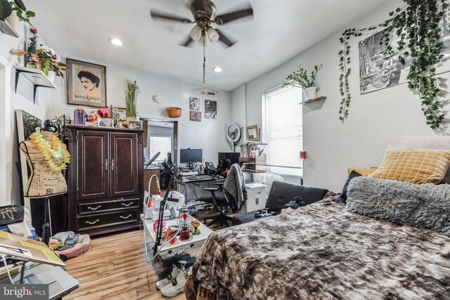 bedroom featuring light wood-type flooring and ceiling fan