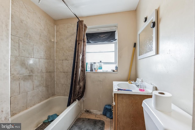 bathroom with vanity, tile patterned flooring, and shower / tub combo