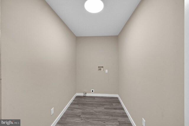 laundry area featuring electric dryer hookup, hardwood / wood-style flooring, and washer hookup