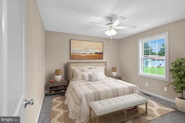 bedroom with ceiling fan and carpet floors