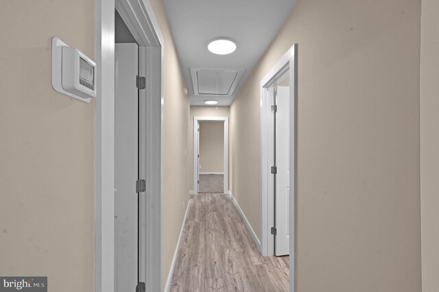 corridor featuring light hardwood / wood-style flooring