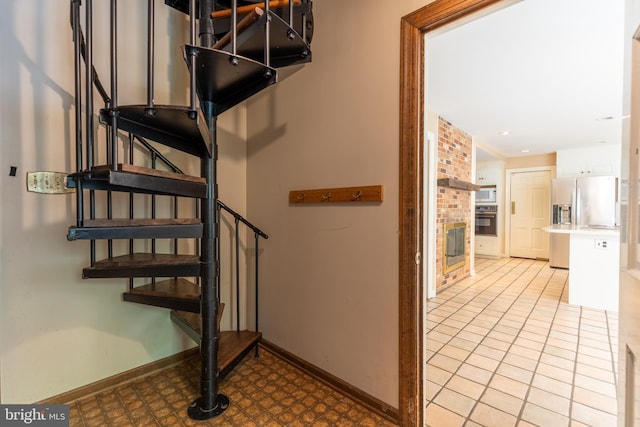 stairs featuring a fireplace