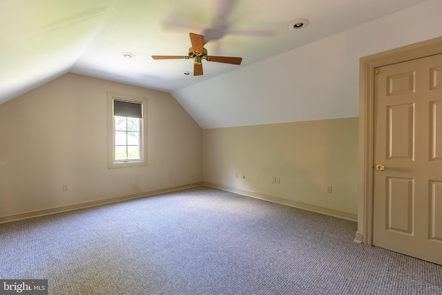 bonus room featuring ceiling fan, light colored carpet, and vaulted ceiling