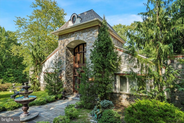 view of home's exterior featuring stone siding