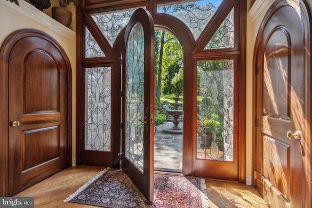 entryway with light wood-style floors