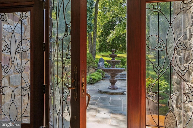 doorway featuring stone finish flooring