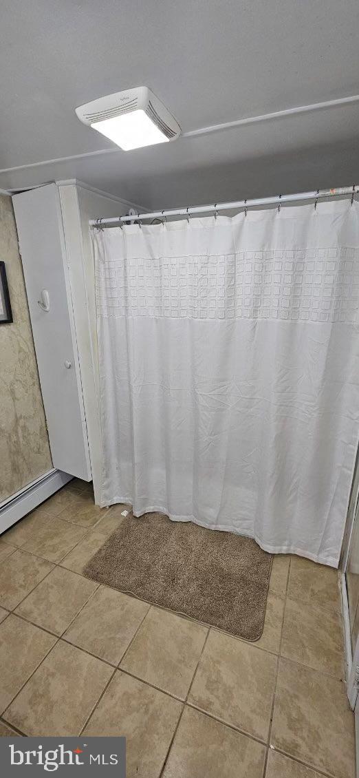 bathroom with tile patterned flooring