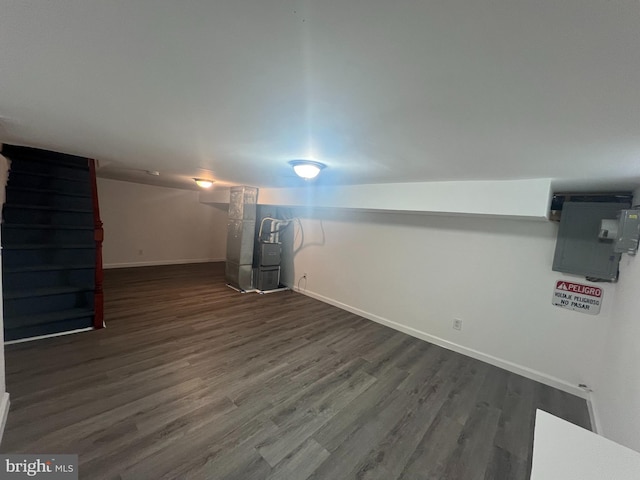 basement with dark wood-type flooring