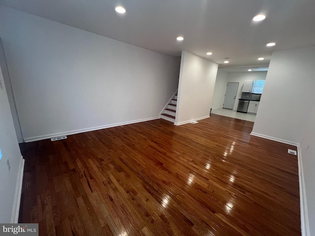 unfurnished living room with hardwood / wood-style floors