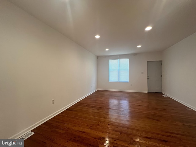 empty room featuring dark hardwood / wood-style floors