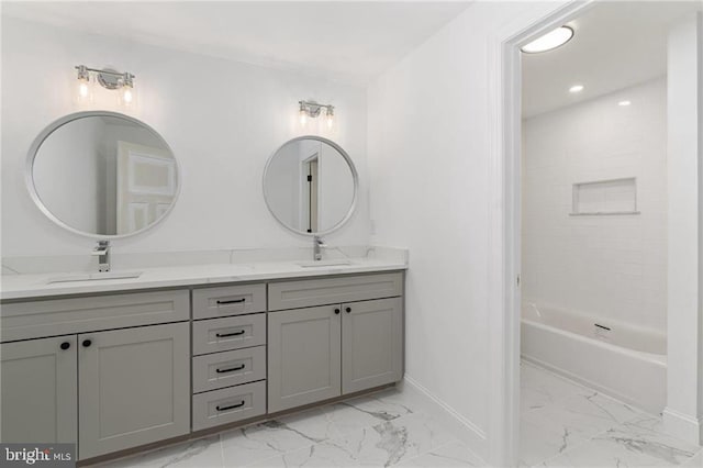 bathroom featuring tile patterned floors, tiled shower / bath combo, and dual bowl vanity