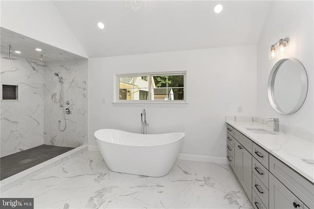 bathroom with vanity, a tile shower, lofted ceiling, and tile patterned floors